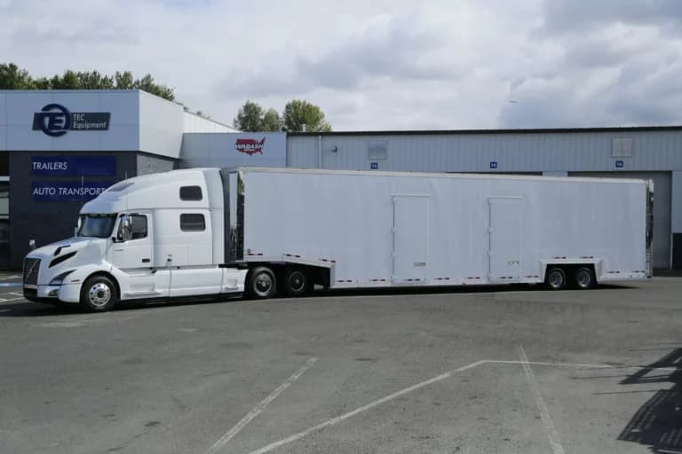 Volvo VNL 860 Tractor with Kentucky XL12 7-Car Enclosed Trailer