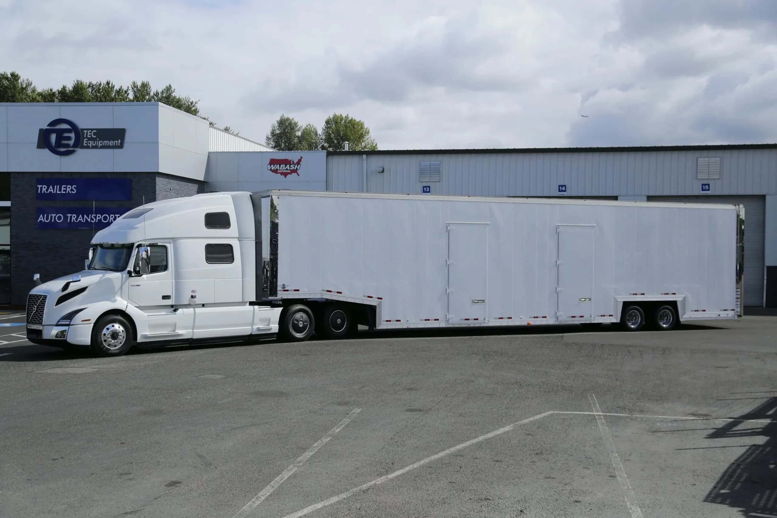 Volvo VNL 860 Tractor with Kentucky XL12 7-Car Enclosed Trailer
