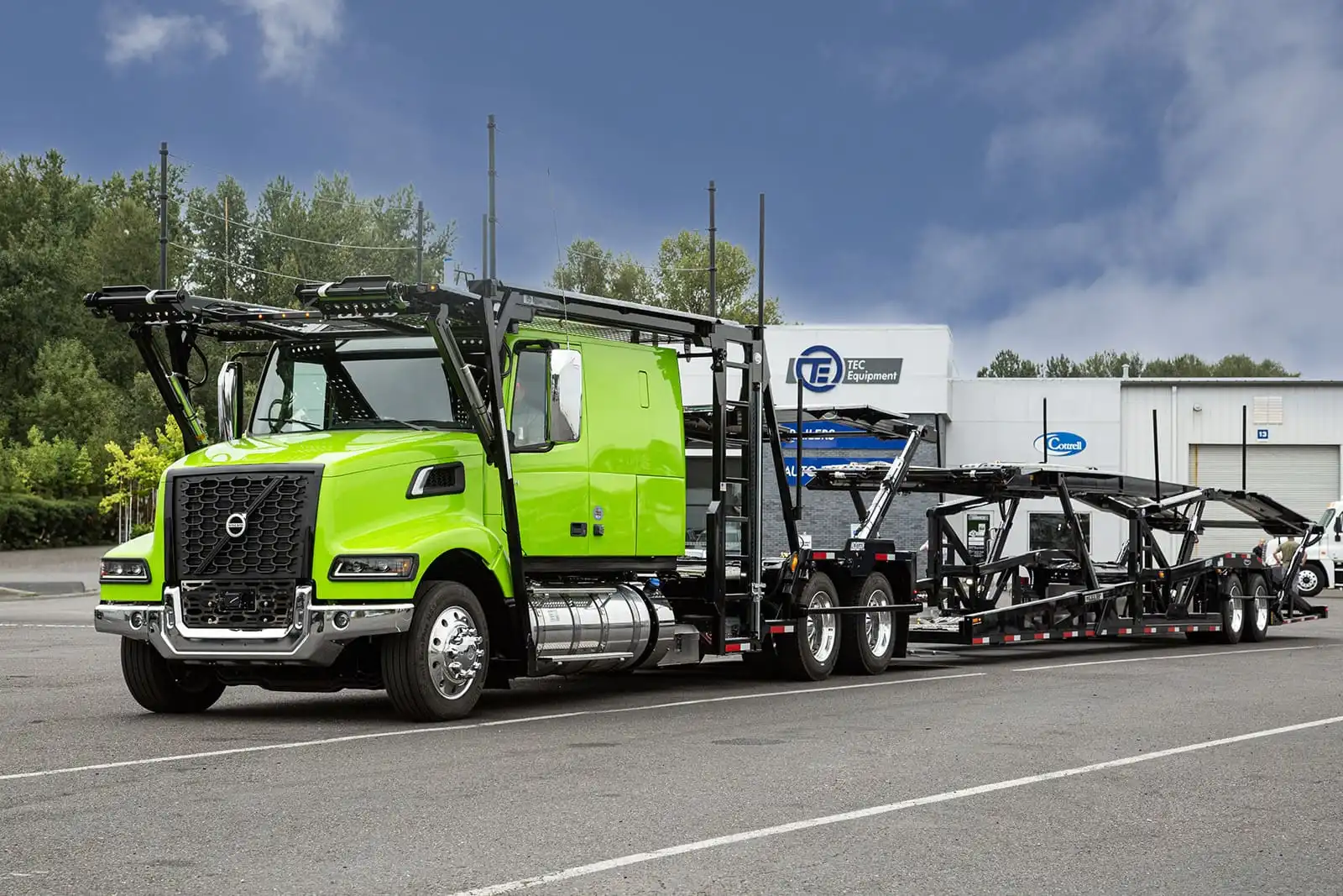 Green Volvo VAH car hauler outside of TEC Equipment - Portland Trailers and Auto Transport