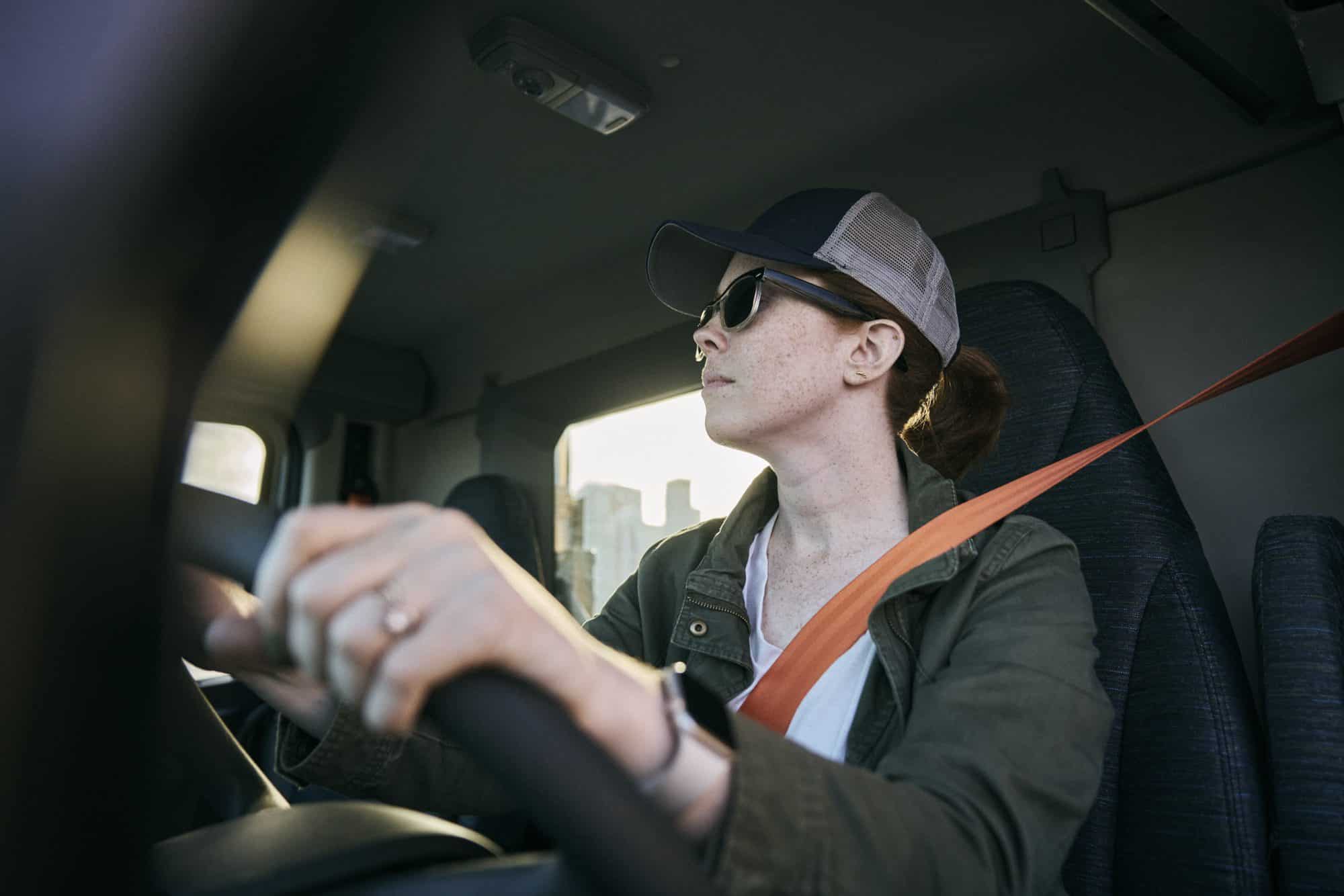 Woman driving a rented all-new Volvo VNR.