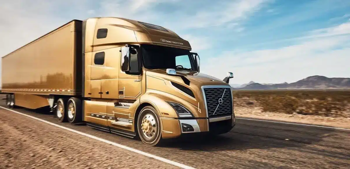 Gold Volvo VNL 860 close up while driving in the desert