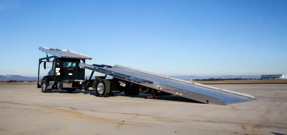 Black Medium-duty 8.5 Ton XLP Multi-Car Carrier parked in a parking lot.