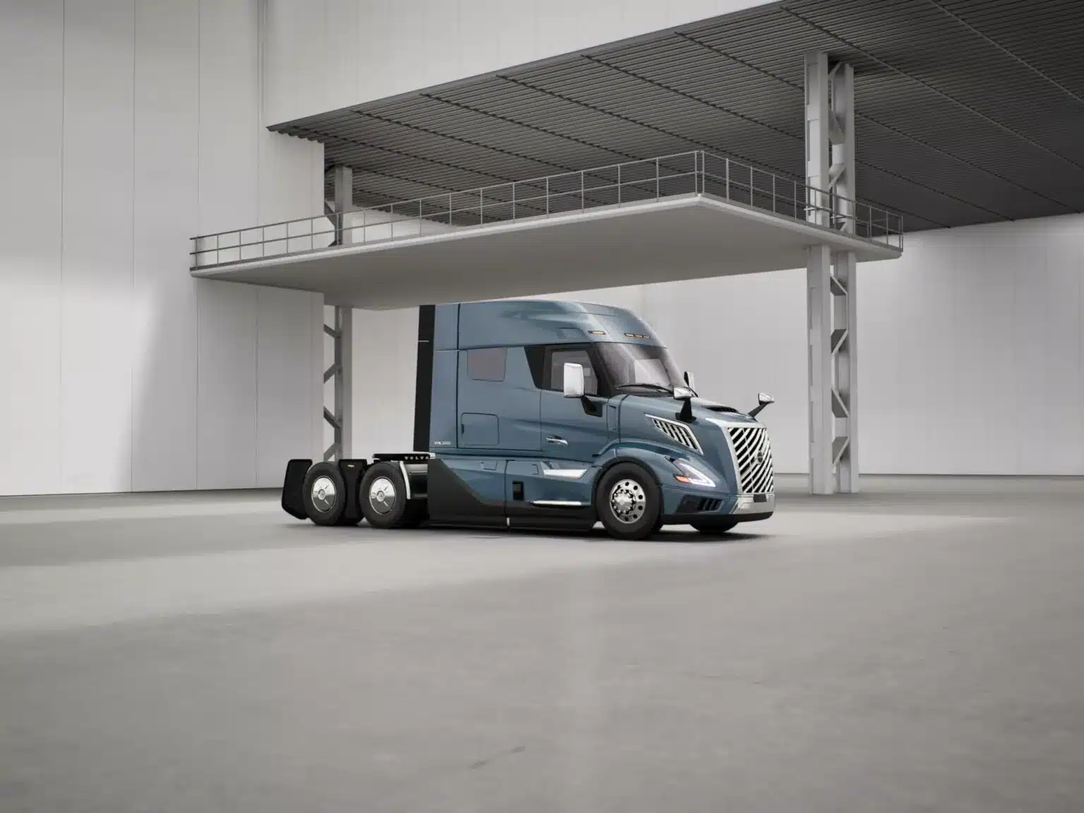 Blue all-new VNL 640 midroof parked in a factory front right facing
