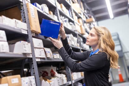 Parts Person Picking Volvo box from Shelf