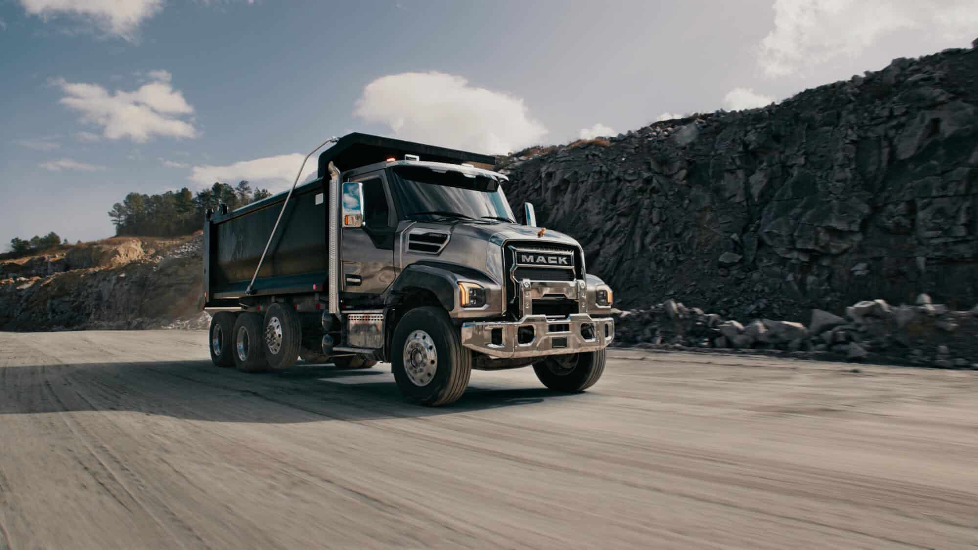 Grey Mack Granite dump truck at a construction site