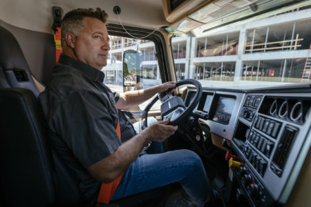 Driver Operating Mack Granite with Command Steer